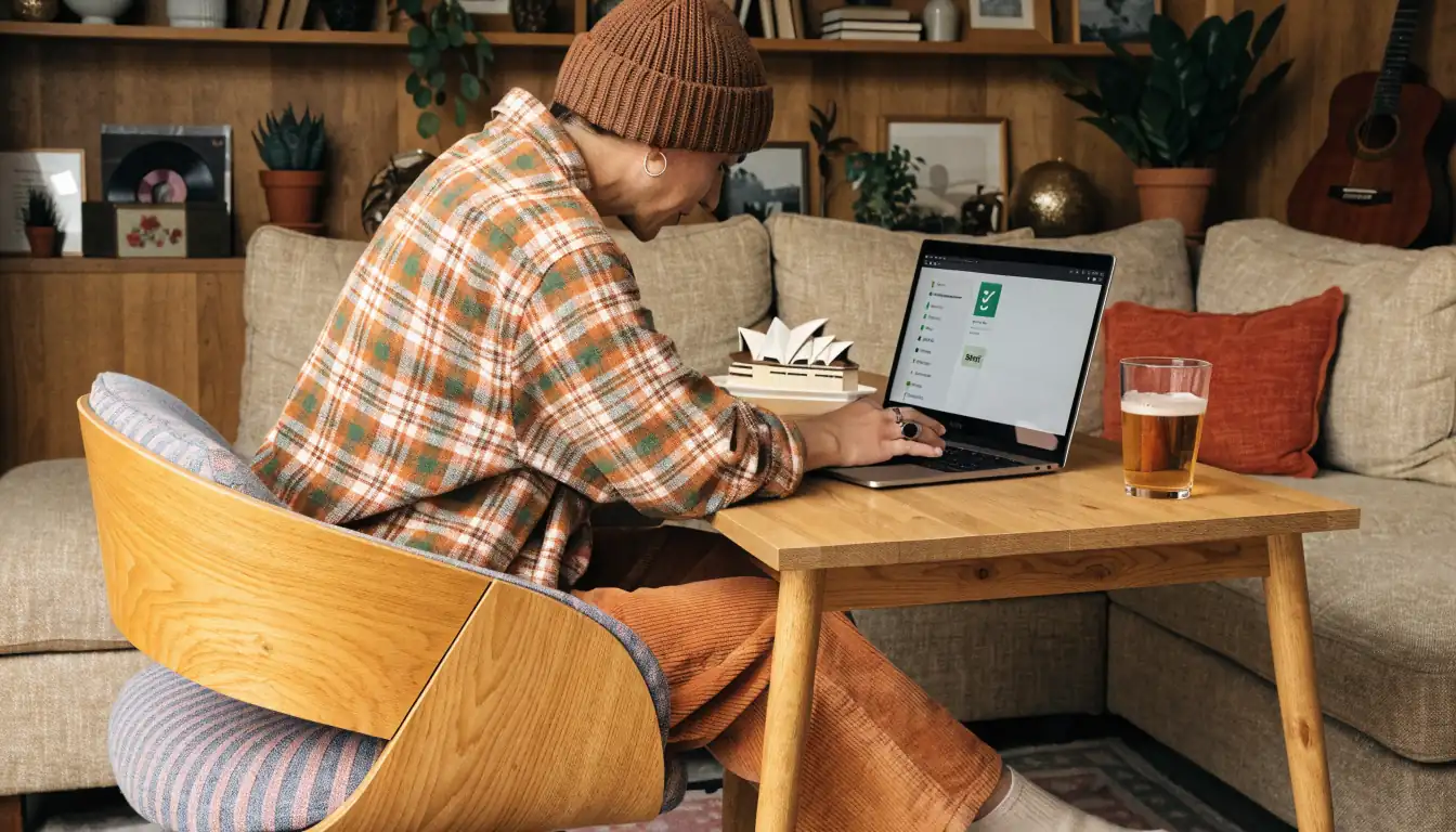 Person reviewing Skrill deposit/withdrawal compatibility on laptop.