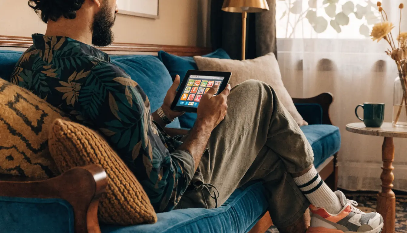 Person testing pokies on tablet in Australian living room